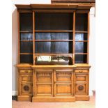 Victorian oak breakfront bookcase, stepped moulded cornice over a reeded frieze,