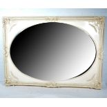 Large cream painted wall mirror, with oval plate, shell swag moulding, 209cm x 147cm.