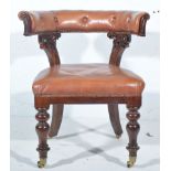 Victorian carved mahogany club style chair, buttoned leather curved back rail,