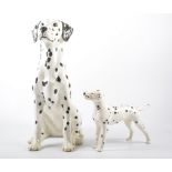 Beswick, a Fireside model of a Dalmatian, together with three other Dalmatian figures,
