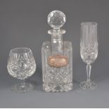 A lead crystal decanter with silver whisky label, four Stuart brandy balloons,