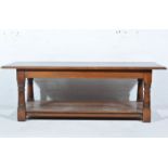 Modern oak coffee table, rectangular top with a moulded edge, turned legs joined by a boarded shelf,