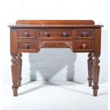 Victorian mahogany five-drawer dressing table, short gallery back, rounded rectangular top,