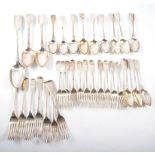 A quantity of silver fiddle pattern cutlery, various dates and makers comprising:- six table forks,