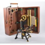 A J Swift & Sons London brass monocular microscope in a fitted mahogany case,