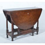 Small joined oak gateleg table, oval top with two fall leaves, turned legs, frieze drawer,