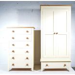 Part painted pine bedroom suite, comprising wardrobe with pair of panel doors above a drawer,