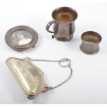Small silver christening mug, napkin ring, a mounted frame,