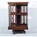 Victorian inlaid mahogany revolving bookcase, serpentine outline, inlaid arrow and swag roundel,