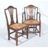 Set of five late Georgian oak dining chairs, arched backs, pierced vase slats, drop-in seats,