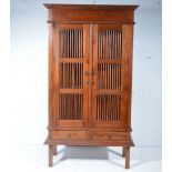 Eastern style hardwood cabinet, spindle panel doors and sides, W98cm x D40cm x H175cm.