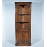 Reproduction oak free-standing corner cupboard, moulded cornice, open section with two shelves,