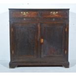 George III oak cupboard, rectangular top, two frieze drawers above a brushing slide, cupboard below,