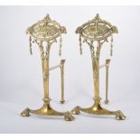 Pair of brass andirons, oval plaque tops, with cast decoration on hoof feet, height 40cm,