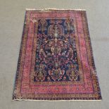 Iranian rug, navy field with stylised foliate design enclosed by multiple scrolling borders,