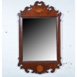 Edwardian mahogany wall mirror, Chippendale style, inlaid ovals, rectangular plate, 88cm, 53cm.