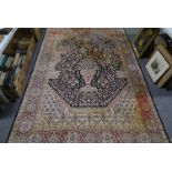 Kirman Persian pattern rug, with a formal decoration on an urn, flowers,