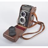 A Rolleicord DBP Va twin lens camera in original leather case.