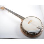 A Dulcet banjo, 85cm overall, two other cased banjos, six other banjos and three banjo-ukuleles,