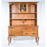 Edwardian oak dresser, plain cornice, panel back with a glazed door and two shelves,