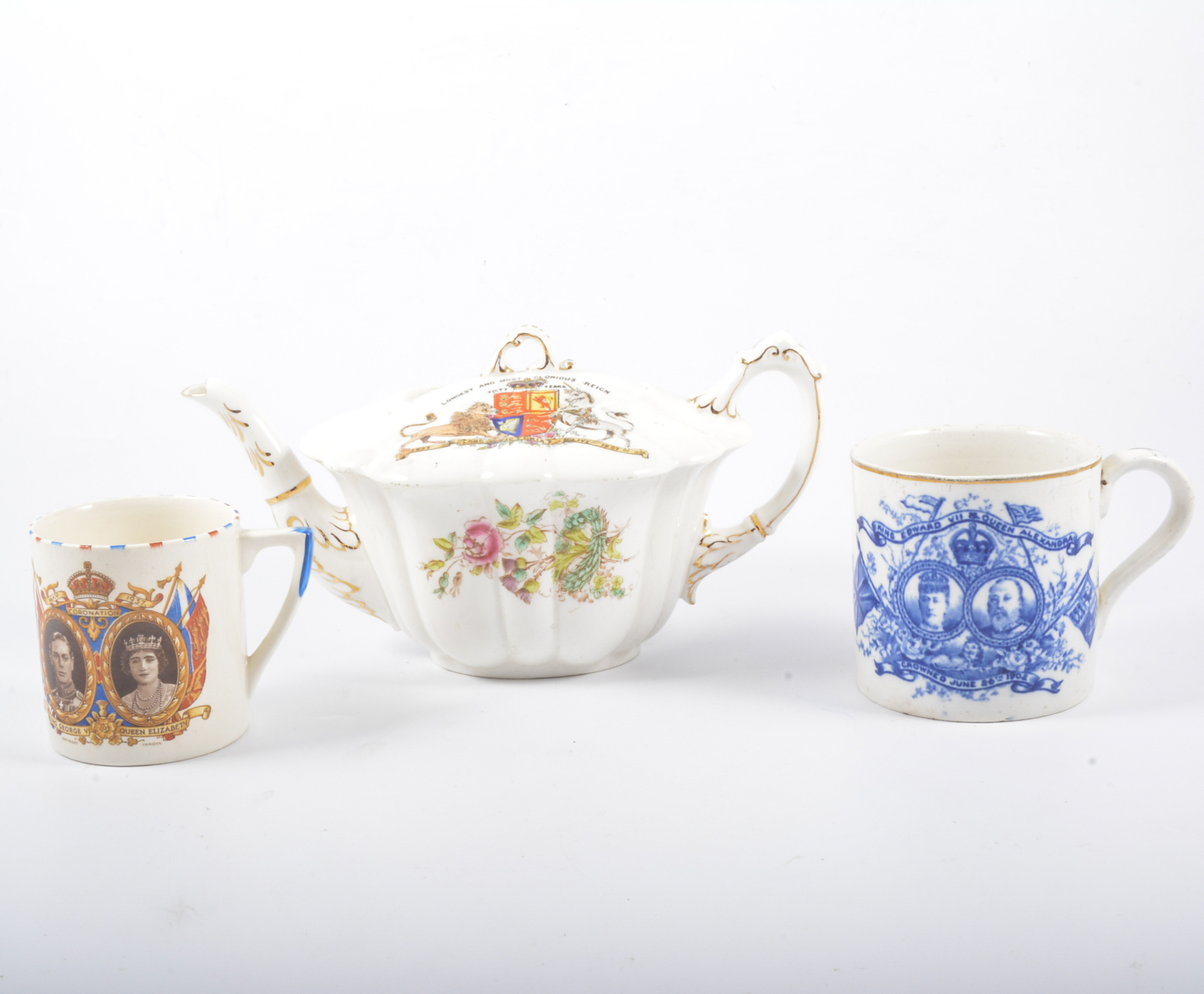 Tray of commemorative china, including a teapot ribbon plates and mugs.