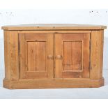 Pine corner TV stand, with panel cupboard doors, W100cm x D56cm x H59cm.