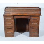 Oak roll-top desk, curved tambour enclosing fitted interior, twin pedestals fitted with drawers,