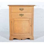 Small oak cabinet, rectangular top with a moulded edge, two drawers above a carved cupboard,