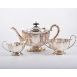 Two trays of metalware, silver-plated teaset, a pair of telescopic candlesticks,