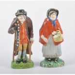 A pair of Staffordshire "Old Age" figures, Woods type, restored, 18cm.