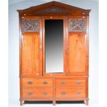 Victorian walnut wardrobe, architectural pediment with a carved panel,