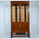 Oak display cabinet, two glazed panelled doors, W90cm x D32cm x H177cm.