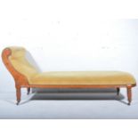 Edwardian style chaise longue, scroll upright, stained wood frame on turned and ringed legs,