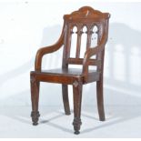 Solid oak Gothic revival armchair,