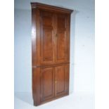 Georgian oak free-standing corner cupboard, moulded cornice, panelled doors, adapted, width 110cm,