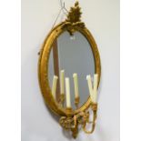 Gilt gesso oval girandole, 19th century with carved shell crest,