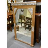 Art Deco style gilt and silvered over-mantle mirror, with carved stylised panels,