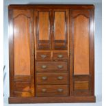 Edwardian walnut triple wardrobe, moulded cornice, central section of drawers and cupboard,