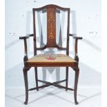 Edwardian inlaid mahogany elbow chair, shaped arms, upholstered seat, cabriole legs joined by rails,