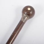 A walking cane, the handle in the form of a bowling wood, London maker.