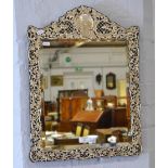 Plated filigree framed bevelled glass wall mirror.