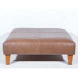 Large stitched leather stool, raised on on cherry wood supports, 93cm square, height 34cm.