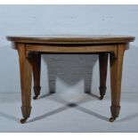 Victorian mahogany wind-out dining table, oval top with a moulded edge, boxwood stringing,