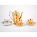 A Wade gold lustre coffee service, coffee cans and saucers with a silver lustre pattern,