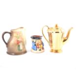 A Wade gold lustre coffee set, a Royal Doulton "Mr Pickwick" 14cm jug,