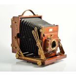 The Sanderson regular half plate mahogany field camera, (damaged), with six mahogany plates,