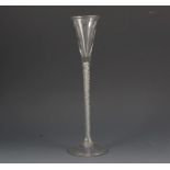 Tall glass ale flute, tapering straight-sided bowl, four strand air-twist stem, circular foot,