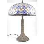 Tiffany style table lamp, shade with blue panelled design, flared pedestal base.