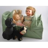A Marmet green plastic "Handi-Kot" carry cot, with a 20" Palitoy walking doll, 12" composition doll,