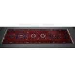 Afghan rug, two rows of tiles within multiple borders,